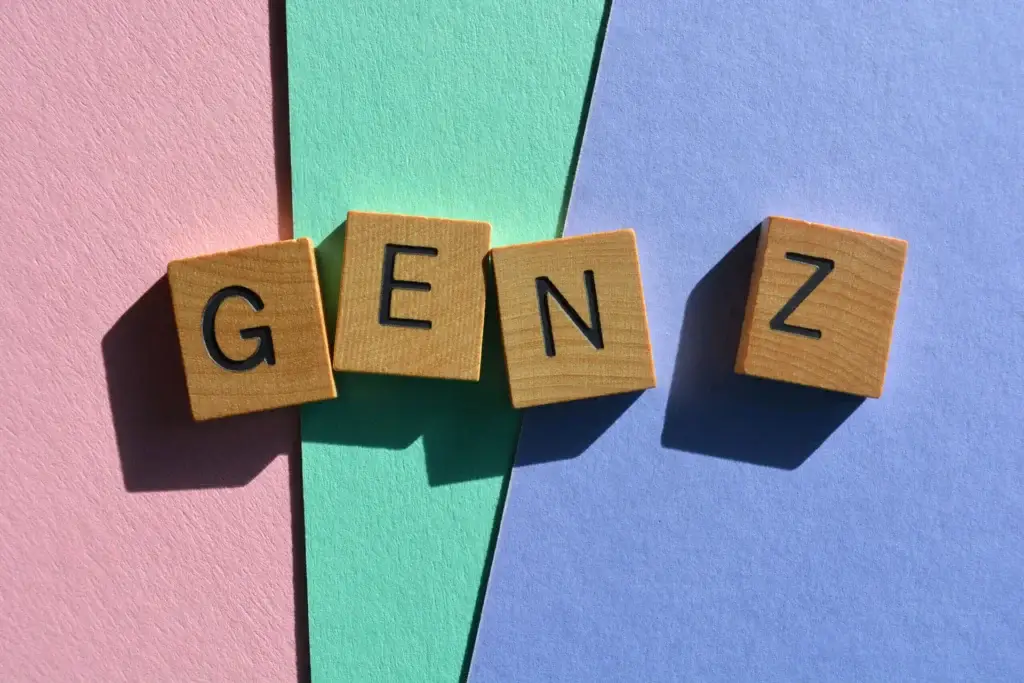 Wooden Scrabble letters spelling out "Gen Z" on colorful background