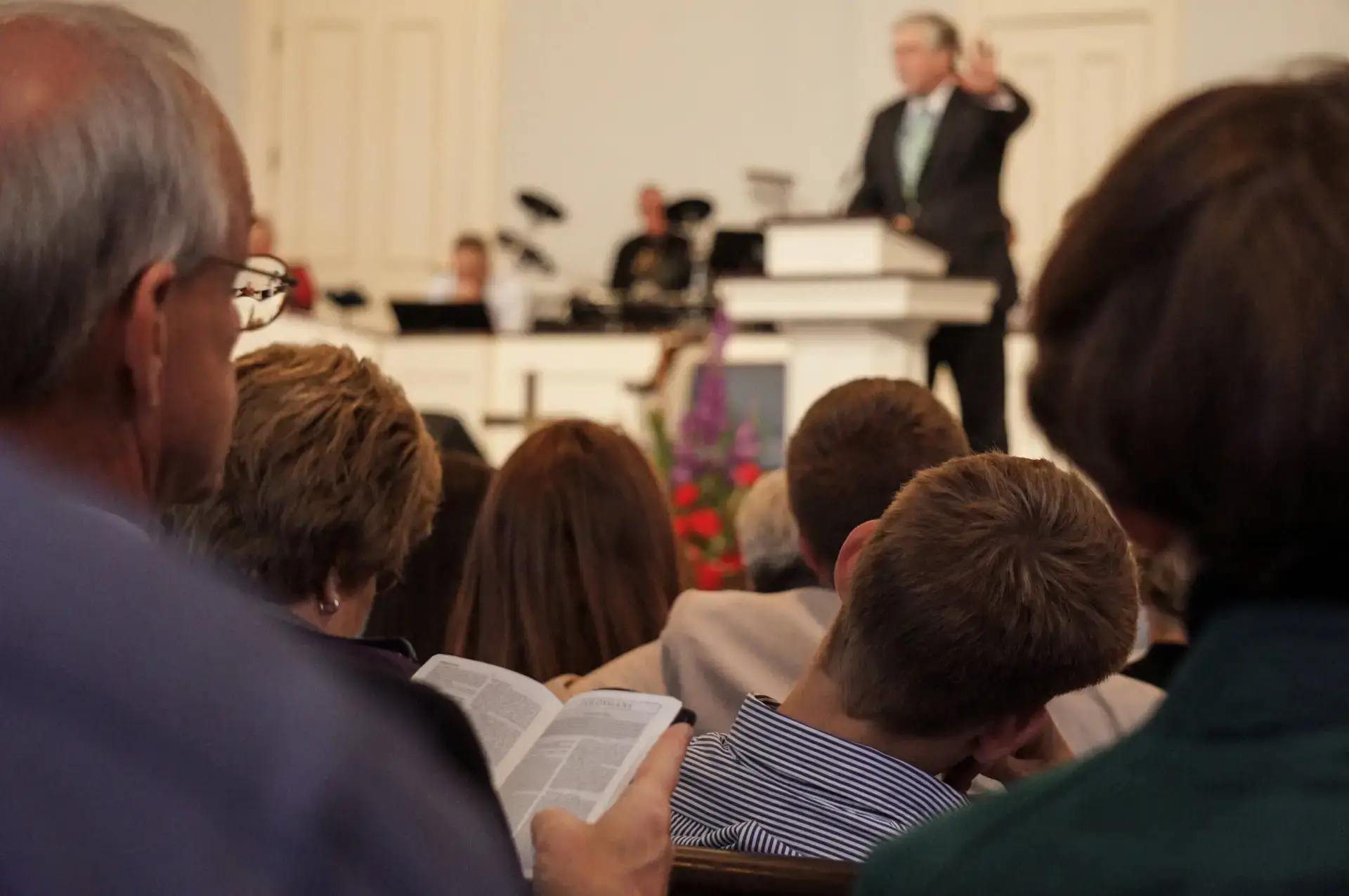 View of ministry leader on stage from congregation.