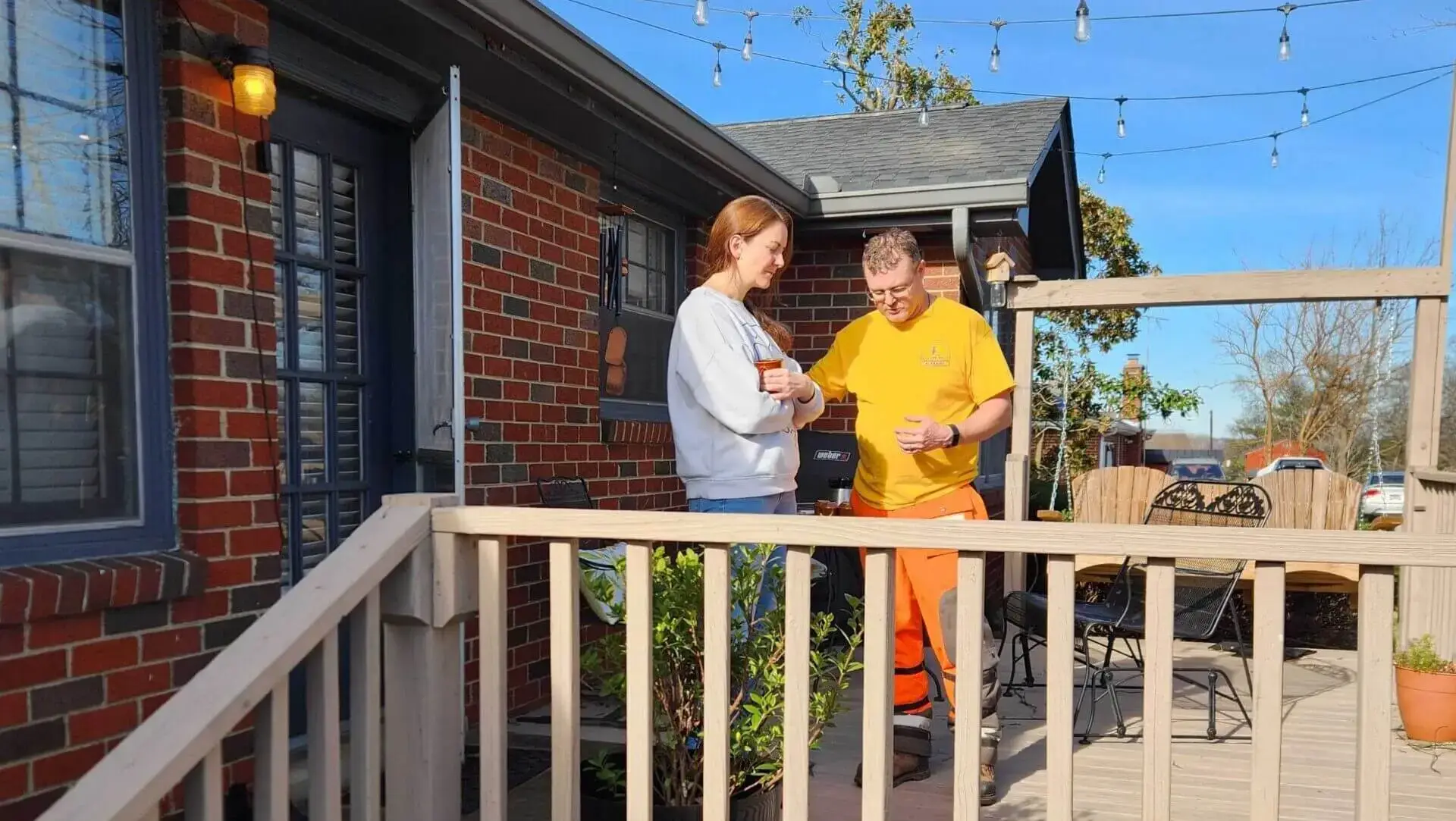 Disaster Relief volunteer prays with resident affected by tornado