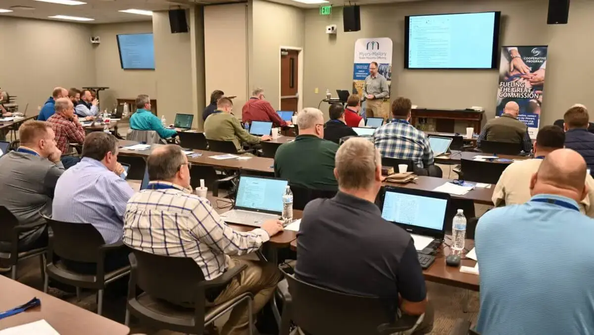 Ministers sit with laptops open at the Alabama Baptist State Board of Missions for training