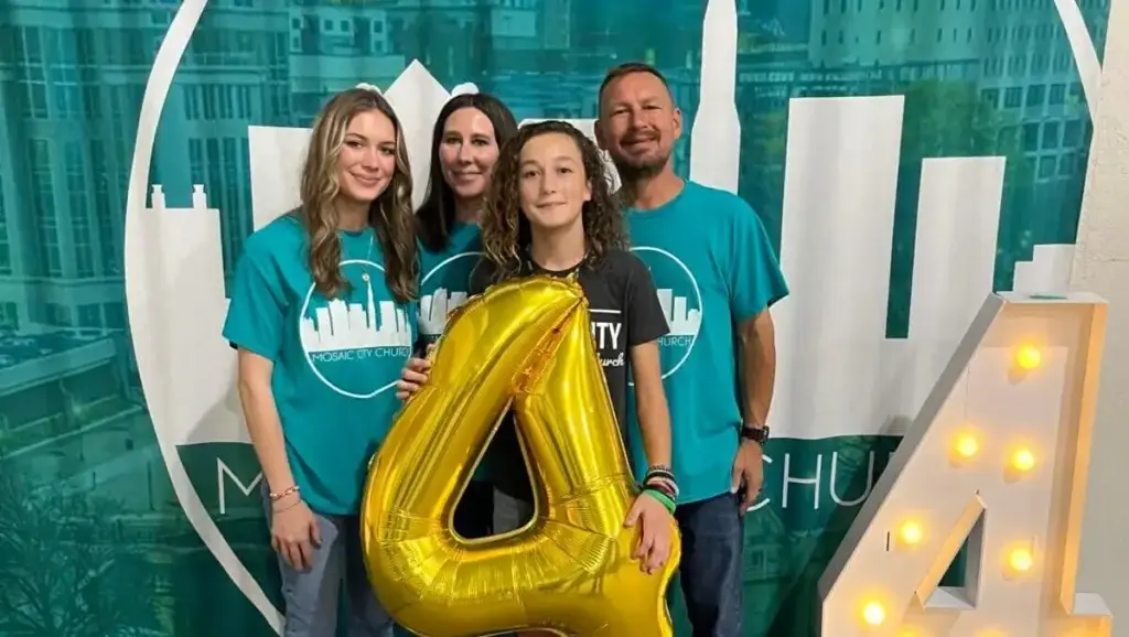 Will Faulkenberry, pastor of Mosaic City Church, Huntsville, stands with his wife, Missy, and daughters Alexis and Ava.