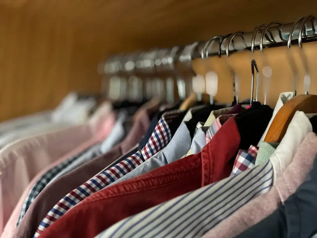 Closeup shot of clothes hanging on hangers in the closet