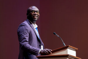 Jarman Leatherwood smiles as he speaks from behind the pulpit at the Alabama Baptist State Convention annual meeting