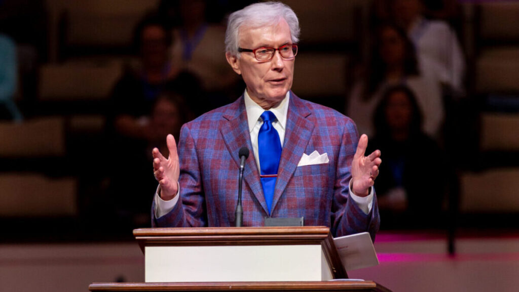 Dr. Rick Lance stands at a pulpit speaking during the 2024 Alabama Baptist State Convention annual meeting