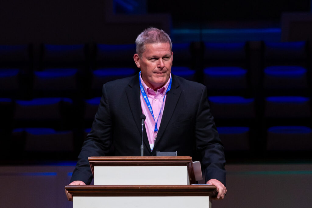 Ryan Whitley stands behind the pulpit at the Alabama Baptist State Convention annual meeting