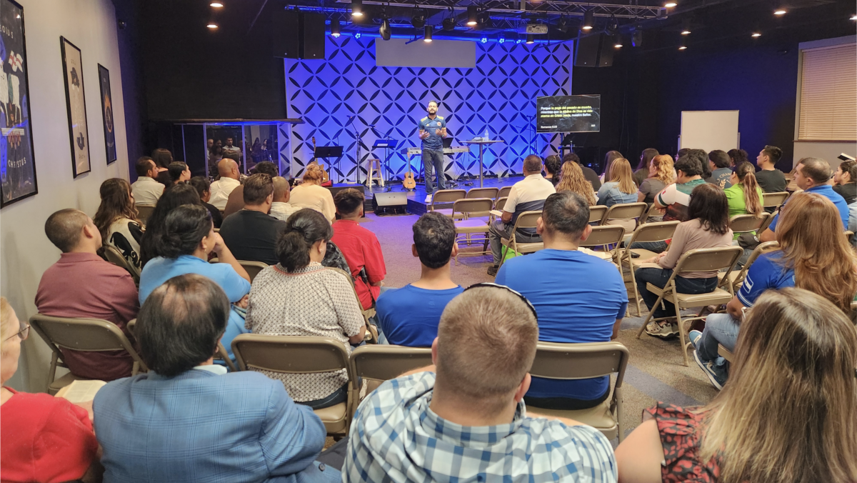 Juan Aristizabal preaches to a congregation at Westwood en Espanol